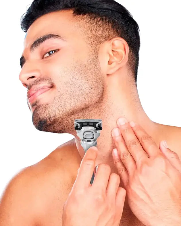 Man using a razor on his neck with a white background